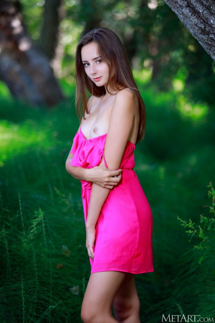 Long-haired brunette Rosalina in lush green nature-06