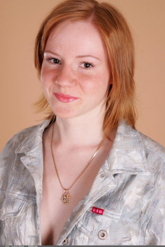 Cute redhead girl Anne shows her tiny tits and ass in a solo show-01