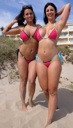 bi Smiles and Chloe Lamour frolic together on the beach in bikinis